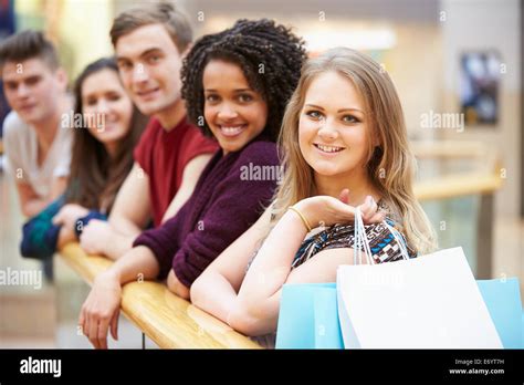 Group Of Young Friends Shopping In Mall Together Stock Photo Alamy