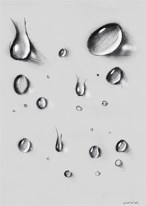 Several Drops Of Water Are Shown In This Black And White Photo One Is