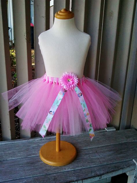 The disney princesses are a class of their own. Pink Disney Princess Tutu with Flower Hair Clip. $25.00 ...