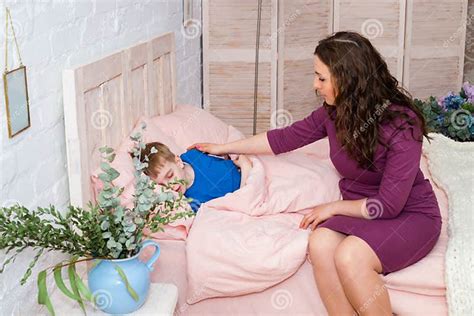 Mum Puts To Bed A Son Mother Putting Son To Bed Stock Image Image Of Love Book 117658515