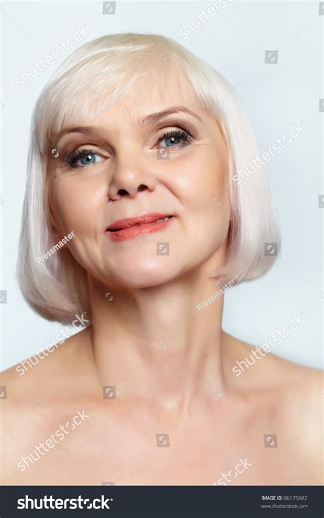 Portrait Of A Nude Senior Woman Smiling At Camera Stock Photo
