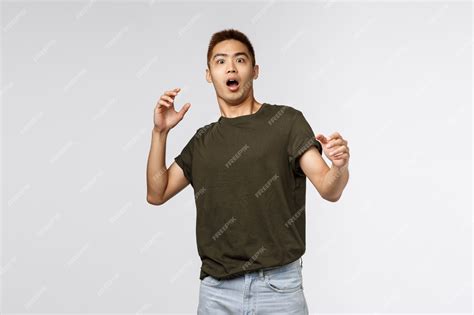 Premium Photo Portrait Of Alarmed And Scared Shocked Asian Guy Gasping