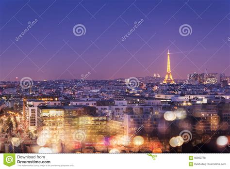 Eiffel Tower Illuminated At Night With Bokeh Lights Montmartre In The