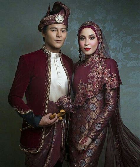 beautiful maroon songket wedding dress designed by rizman ruzaini specially for nazim othman