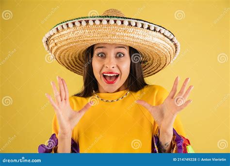 Young Beautiful Girl In Sombrero Isolated Over Yellow Background Stock