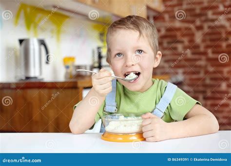 Little Boy Having Breakfast In The Kitchen Stock Image Image Of Plate