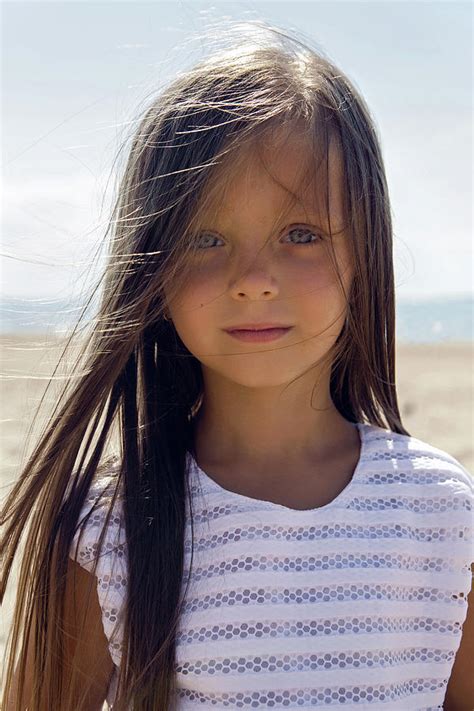 Portrait Of A Tanned Girl On The Sandy Beach Photograph By Elena