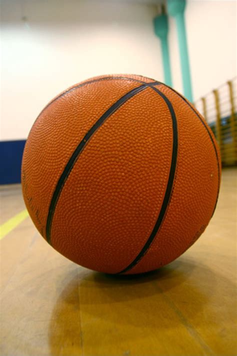 16.1.2 the ball is considered to be within the basket when the slightest part of the ball is within the basket and below the level of the ring. Basketball Rules on Assists | SportsRec