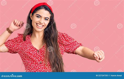 Brunette Teenager Girl Wearing Summer Dress Dancing Happy And Cheerful