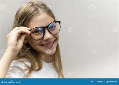 Portrait Of A Smiling Beautiful Young Girl With Glasses Smart Child