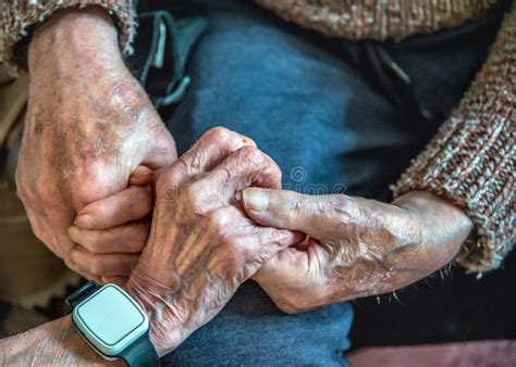 Elderly Couple With Alzheimer S And Dementia Holding Hands And Showing