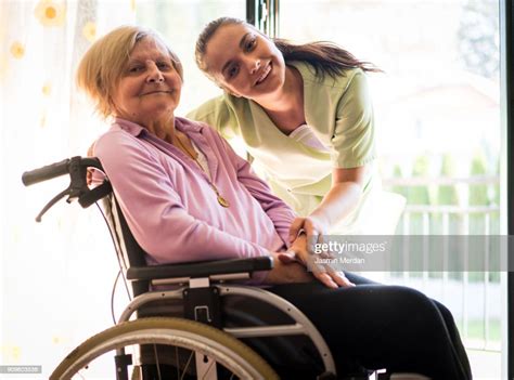 Nurse Taking Care Of Elderly People High Res Stock Photo Getty Images