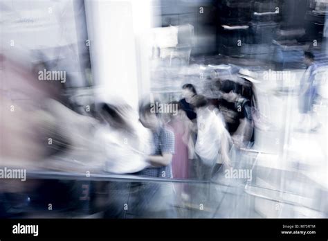 Motion Blur People Taking Escalator In Shopping Mall Stock Photo Alamy