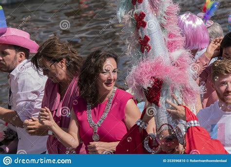 femke halseman on the gemeente amsterdam boat at the gaypride canal parade with boats at