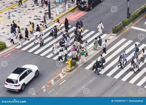 Aerial View Of A Zebra Crossing With Crowds Of People In Shibuya