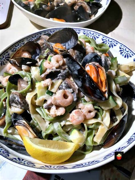 As the weather gets crisper, hearty. Creamy Garlic Seafood Pasta, with a delicious creamy white wine sauce.