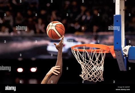 Scoring During A Basketball Game Ball In Hoop Stock Photo Alamy