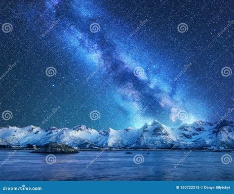 Bright Milky Way Over Snow Covered Mountains And Sea At Night Stock