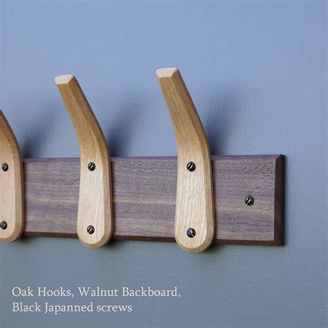 Great coat hooks compliment your space and keep your outerwear organized. curved wooden coat hooks and backboard by layertree ...
