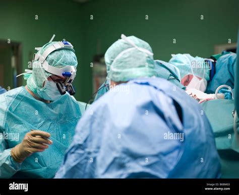Surgeons Performing Operation In Operating Room Stock Photo Alamy