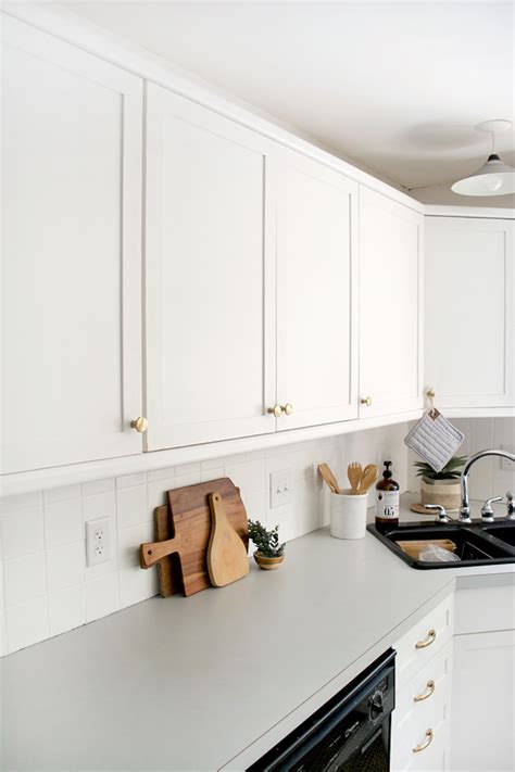 The color of your cabinets helps set the tone for your kitchen, so it deserves careful consideration. How to Add Trim and Paint Your Laminate Cabinets | brepurposed
