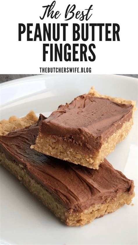 Two Pieces Of Chocolate Peanut Butter Fingers On A White Plate With The