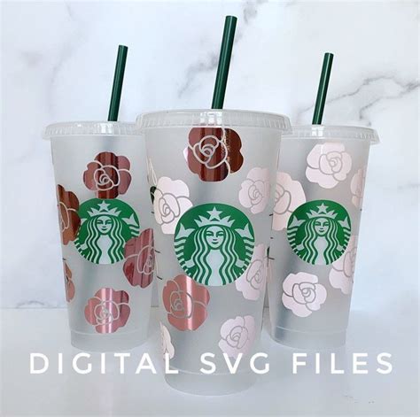 Three Starbucks Cups With Flower Designs On Them And Straws In The Cup
