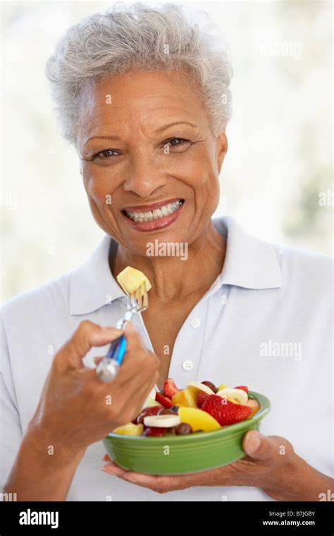 Senior Adult Eating A Fresh Fruit Salad Stock Photo Alamy