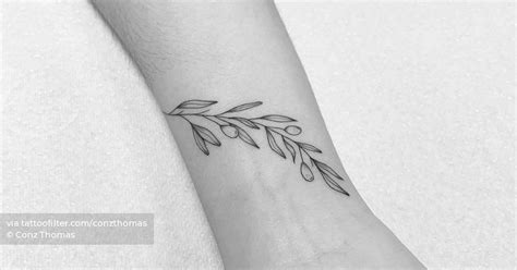 Fine Line Olive Branch Tattoo On The Wrist