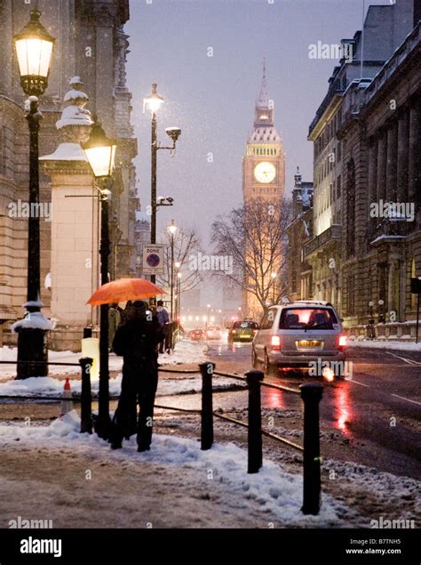 Snow At The Corner Of Birdcage Walk With Big Ben London Uk Europe Stock