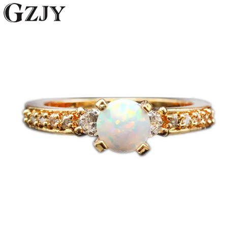 Gzjy New Beautiful Simple Round Jewelry White Fire Opal Zircon Champagne Gold Color Wedding Ring