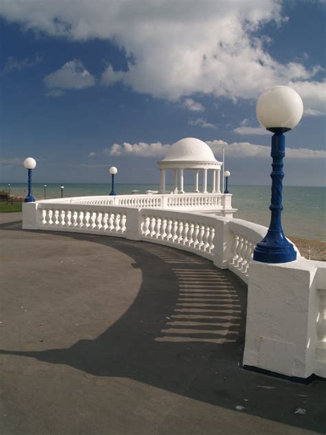 Bexhill Beach Photo Globes Clouds And Balustrade