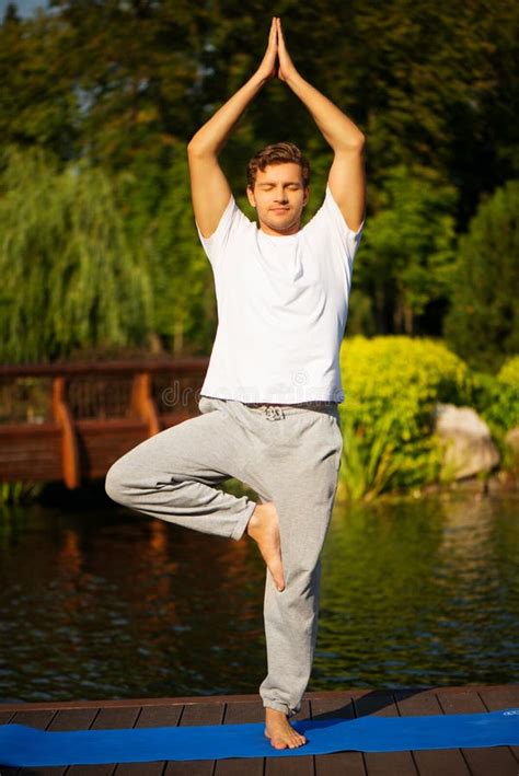 Young Man Practicing Yoga Doing Tree Pose Stock Image Image Of Hand