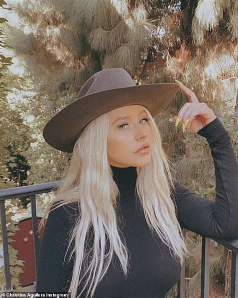 Christina Aguilera Shares A Stunning Selfie Modeling Orange Pants And A Bright Yellow Mani Pedi