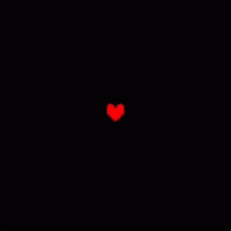 A Red Heart In The Middle Of A Black Background