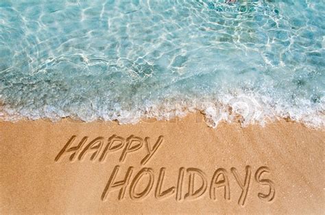 Happy holidays sign on the beach sand | Stock image | Colourbox