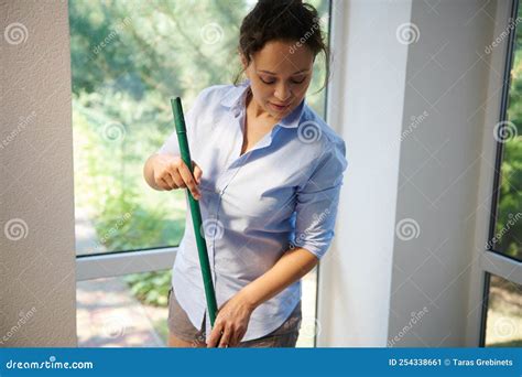 Woman With Mop Cleaning Balcony Floor Hispanic Housekeeper Cleaner Housewife Washing At Home