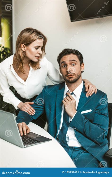 Flirtation Or Sexual Harassment Blonde Woman Seduces Man Working With Laptop Colleagues Flirt