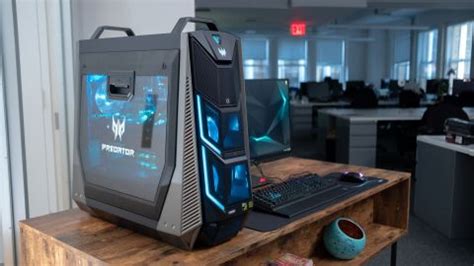 The top cover is attached with 2 little levers you need to push outward sideway under the handle while the front should be pushed or squeezed up. Acer Predator Orion 9000: Reviews and Design - Karn Technical