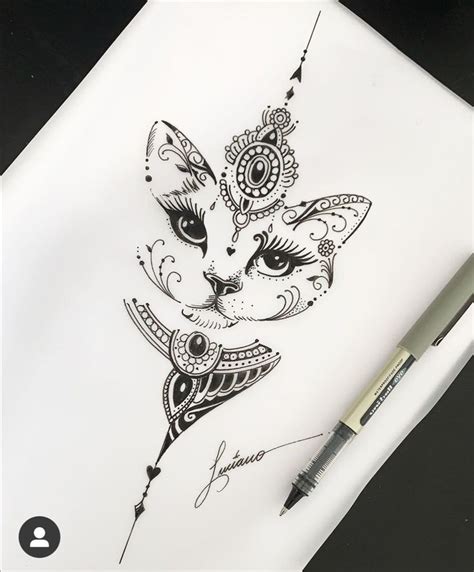 A Pen Is Sitting On Top Of A Piece Of Paper With A Drawing Of A Cat