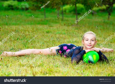 Flexible Little Blondie Girl Doing Gymnastics Horizontal Split Stock