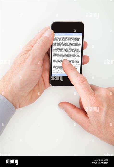 Close Up Of Businessman Reading Text In Cellphone Stock Photo Alamy