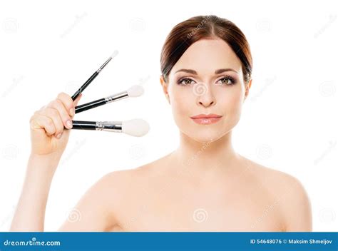 Portrait Of A Young Woman In With Makeup Brushes Stock Photo Image Of