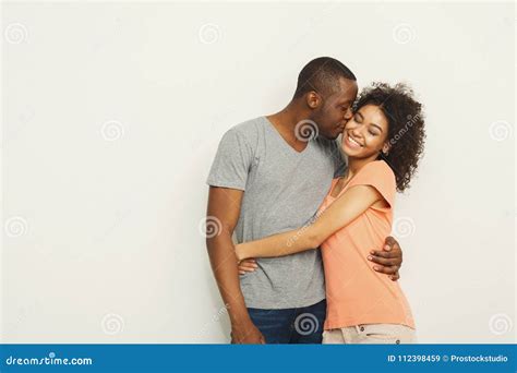 Smiling Black Couple Embracing At White Studio Stock Image Image Of
