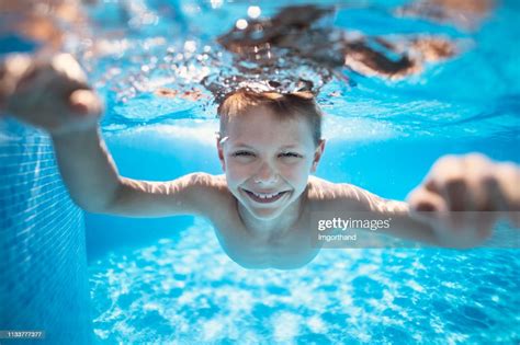 Little Boy Swimming Underwater In Pool High Res Stock Photo Getty Images