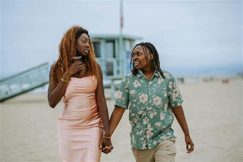 2 Women Standing On Beach · Free Stock Photo