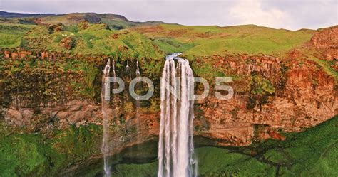 Aerial Drone View Of Seljalandsfoss Waterfall At Sunset Iceland Stock