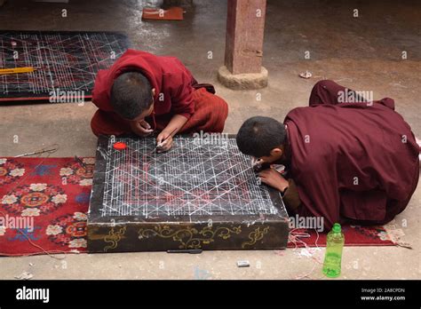Buddhist Monks Practicing Drawing A Mandala Inside Sakya Monastery
