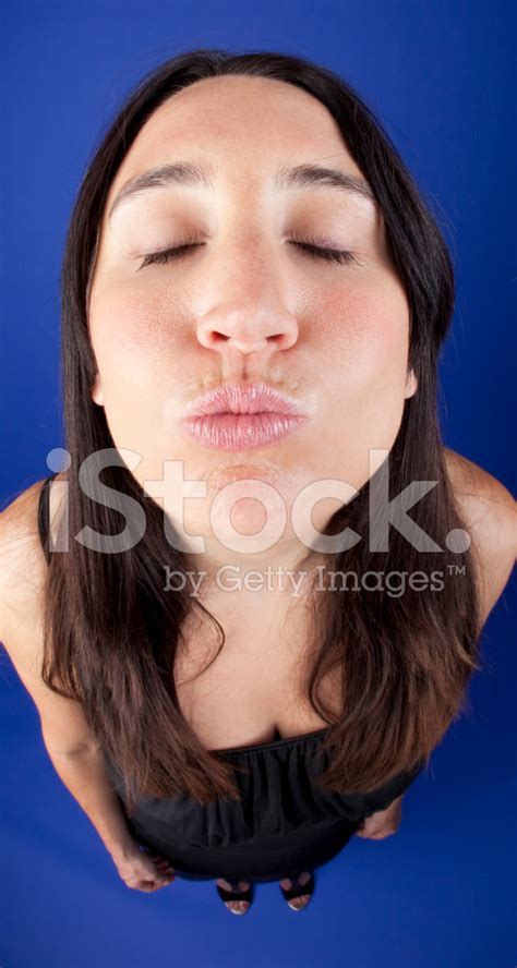 Fisheye Photo Of Woman Puckering Lips For A Kiss Stock Photo Royalty