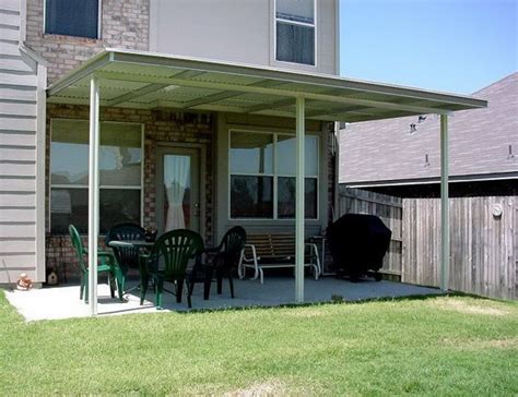 Elegant furnishings and decor are set around a fireplace. Patio Rooftop Terrace Inexpensive Ideas | Bill House Plans ...